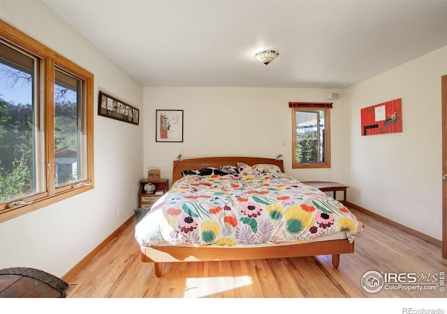 bedroom with light hardwood / wood-style floors