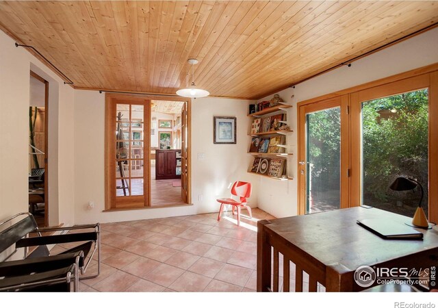 tiled dining space featuring wooden ceiling