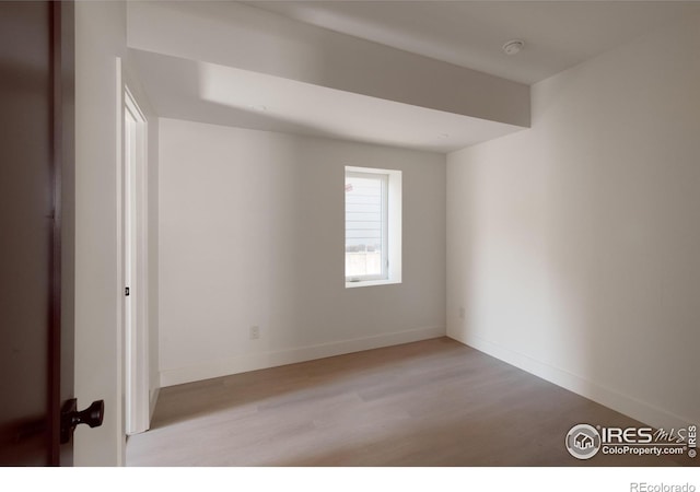 spare room with light wood-type flooring