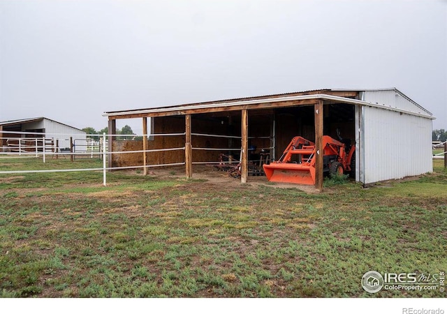 view of outbuilding with a yard