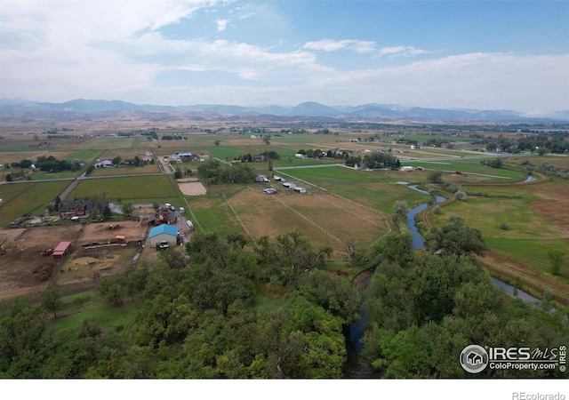 aerial view with a mountain view and a rural view