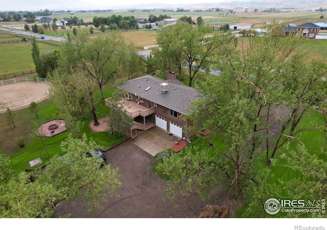 birds eye view of property with a rural view