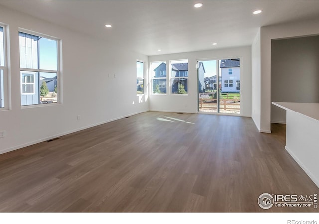 unfurnished room featuring dark hardwood / wood-style flooring