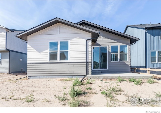 rear view of property featuring a patio area