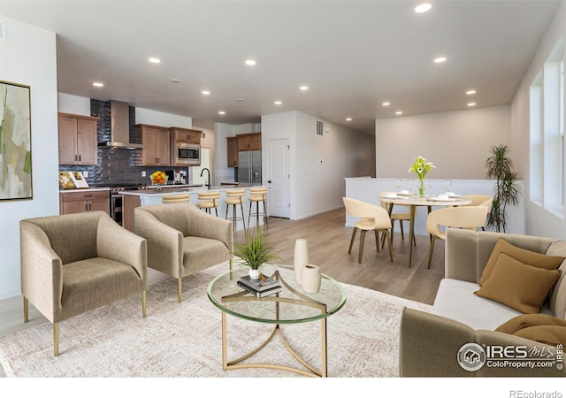 living room with light hardwood / wood-style floors