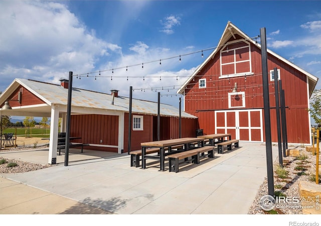 view of patio featuring an outdoor structure