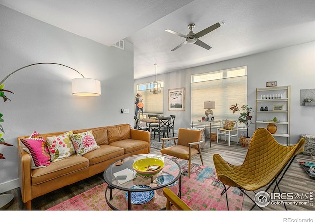 living room with hardwood / wood-style floors and ceiling fan