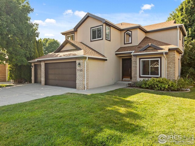 front of property featuring a garage and a front yard