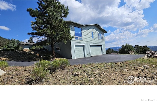 view of property exterior with a garage