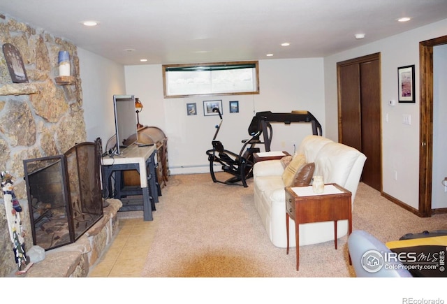 interior space featuring light tile patterned flooring and a fireplace