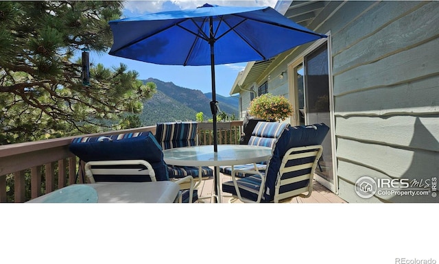 wooden terrace with a mountain view