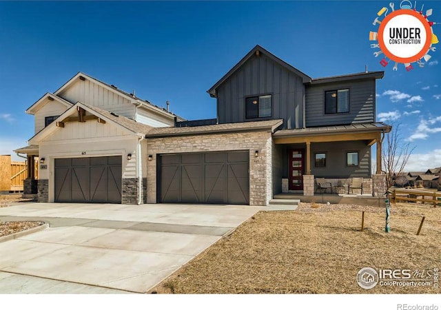 view of front of property with covered porch and a garage