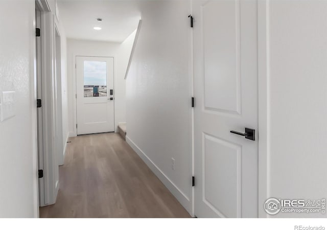 corridor featuring light hardwood / wood-style flooring