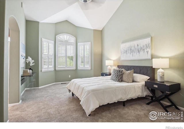 bedroom featuring carpet floors and vaulted ceiling