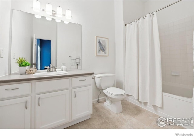 full bathroom featuring toilet, vanity, tile patterned flooring, and shower / tub combo with curtain