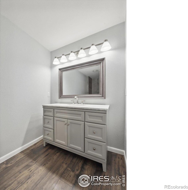 bathroom featuring vanity and wood-type flooring