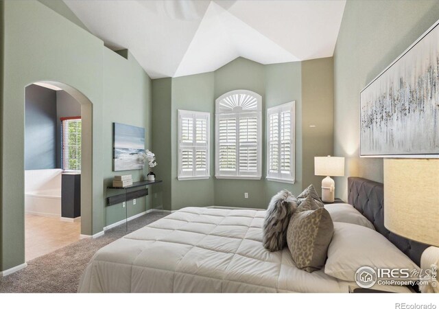 carpeted bedroom with vaulted ceiling