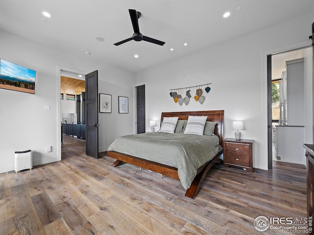 bedroom featuring ceiling fan and hardwood / wood-style flooring