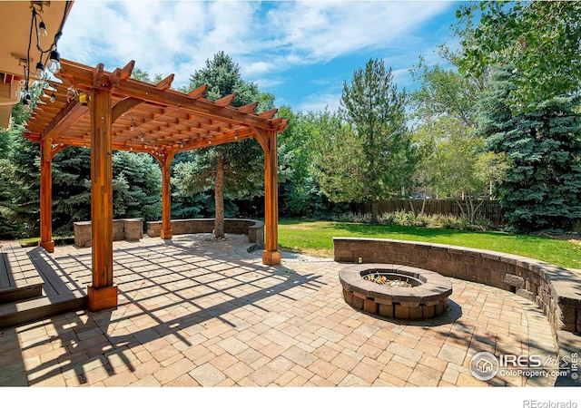 view of patio with a pergola and an outdoor fire pit