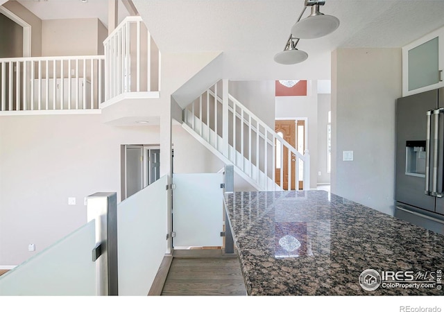 stairs featuring hardwood / wood-style flooring