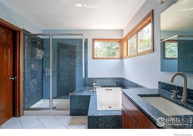 bathroom featuring vanity, separate shower and tub, and tile patterned floors