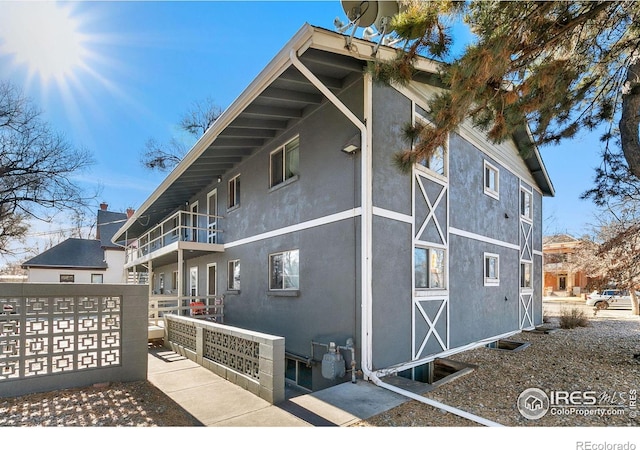 view of property exterior featuring a balcony