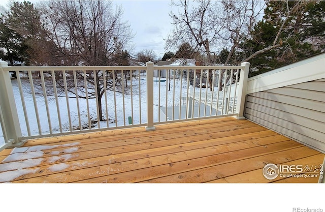 view of snow covered deck