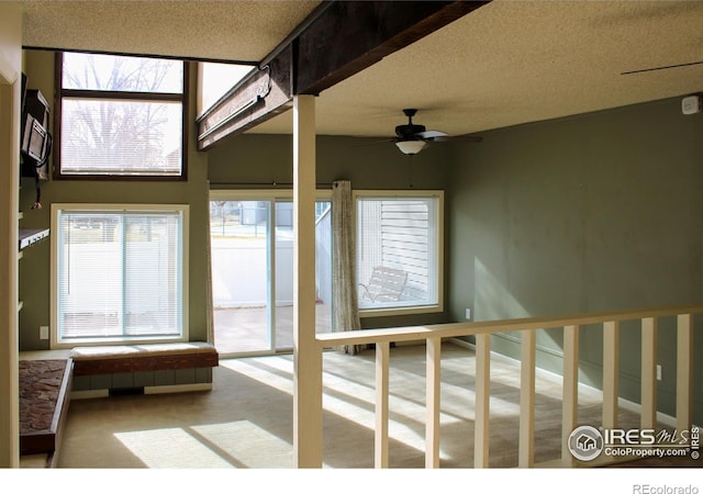 interior space featuring ceiling fan