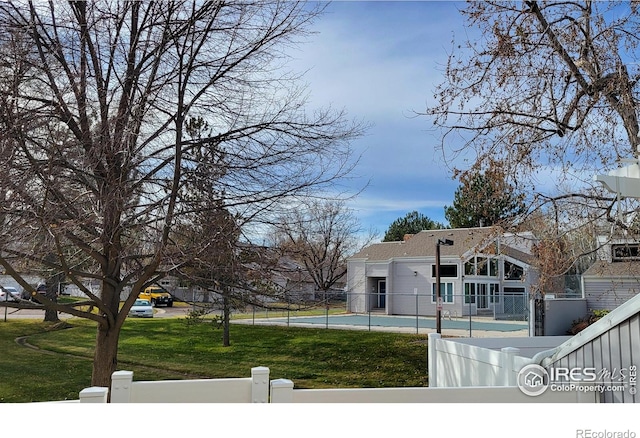 exterior space with a fenced front yard and a yard