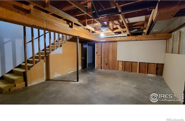 unfinished basement with stairs