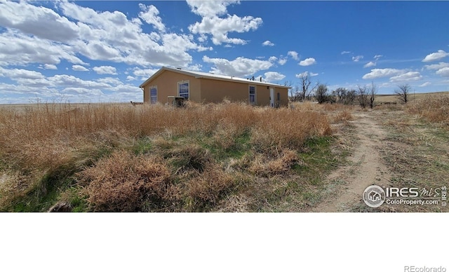 view of property exterior with stucco siding