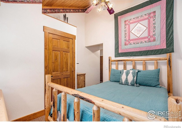 bedroom with wood ceiling and ceiling fan