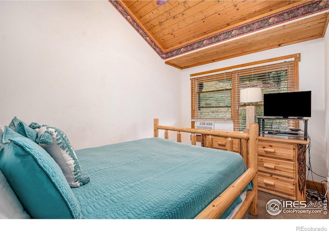 bedroom featuring vaulted ceiling and wooden ceiling