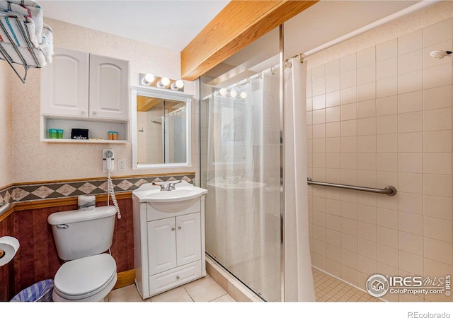 bathroom with toilet, tile walls, tile patterned floors, a shower with shower curtain, and vanity