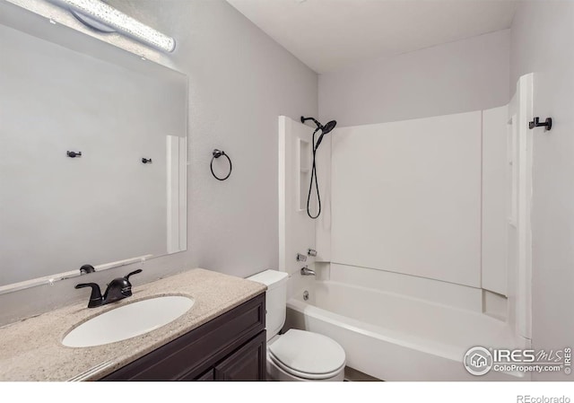 full bath with toilet, vanity, and bathing tub / shower combination