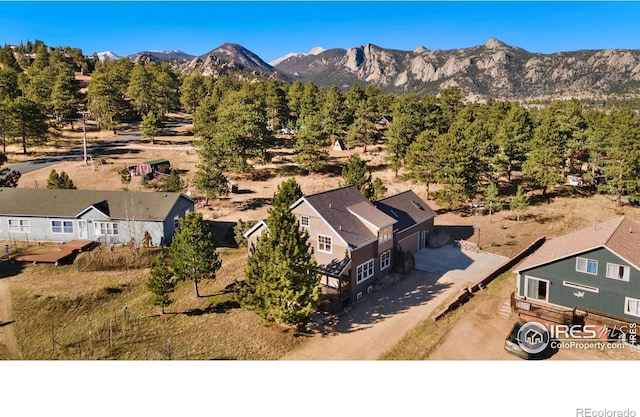 birds eye view of property with a mountain view