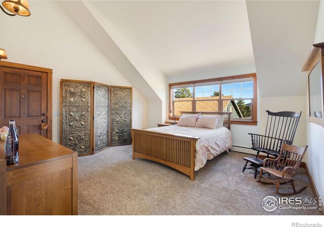 bedroom featuring baseboard heating, high vaulted ceiling, and light colored carpet