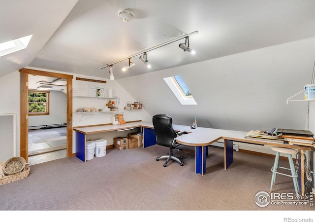 carpeted office with lofted ceiling and a baseboard heating unit