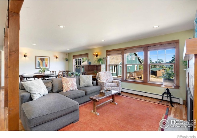 living room featuring hardwood / wood-style floors and a baseboard radiator