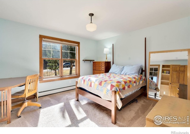 carpeted bedroom with baseboard heating