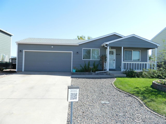 view of front of property with a front lawn, a porch, and a garage