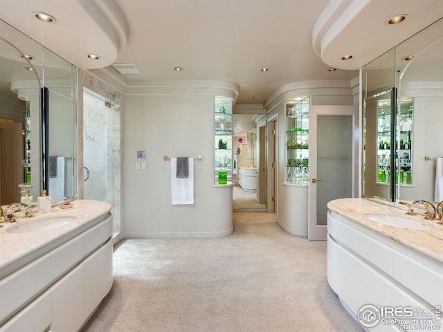 bathroom with a healthy amount of sunlight, a sink, and a stall shower