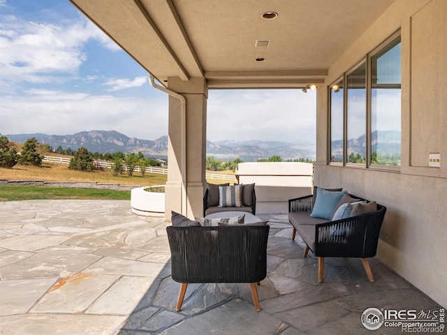 view of patio / terrace featuring outdoor lounge area and a mountain view