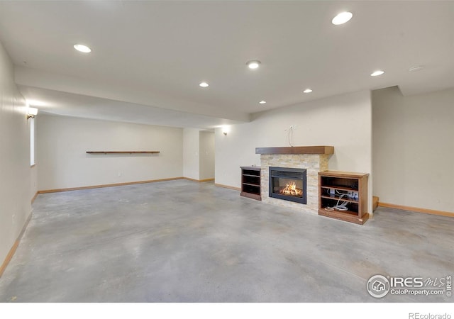 basement with a stone fireplace