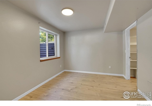 spare room with light hardwood / wood-style floors