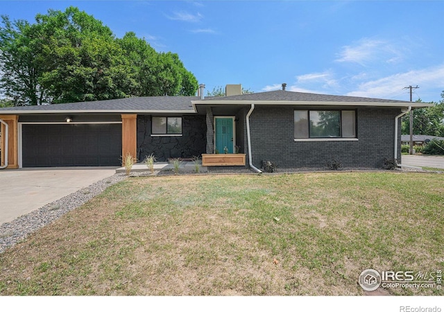 ranch-style home with a garage and a front yard