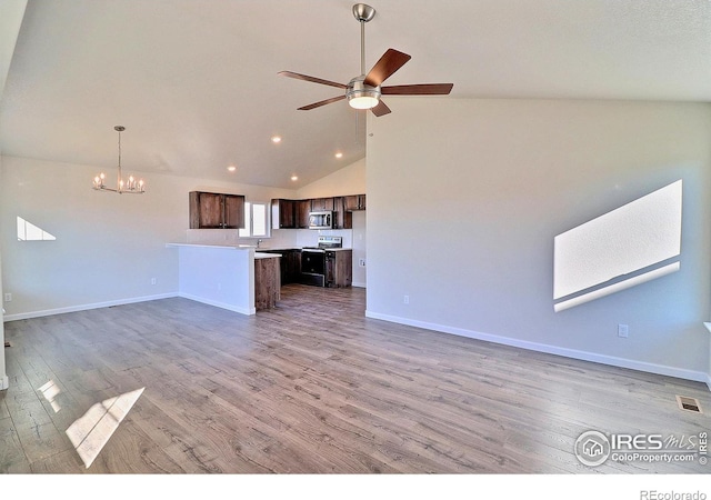 unfurnished living room featuring hardwood / wood-style floors, ceiling fan with notable chandelier, and lofted ceiling