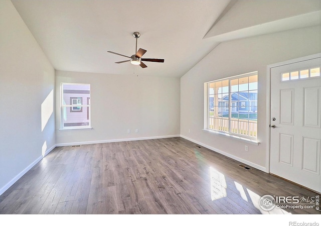 entryway with light hardwood / wood-style floors, vaulted ceiling, and ceiling fan