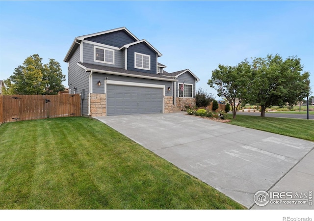 view of front of house featuring a front yard and a garage