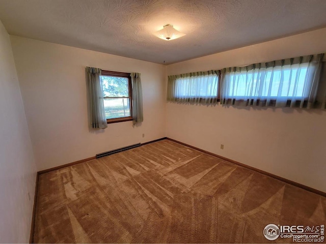 unfurnished room with carpet and a baseboard radiator